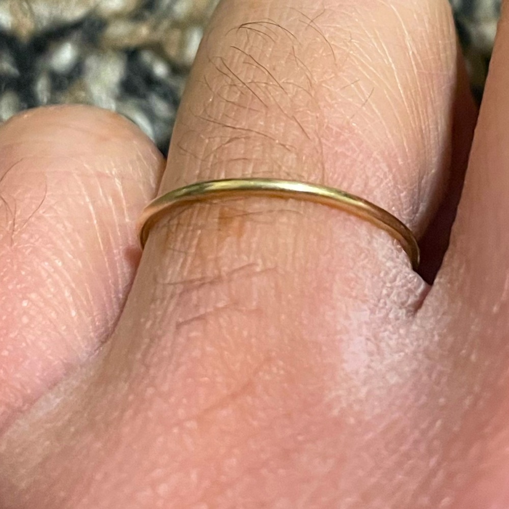 14K 1 mm solid yellow gold ring size 6.25. Good used condition!